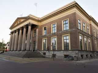 Fototapeta na wymiar courthouse in leeuwarden, capital of the dutch province of Friesland in warm morning light