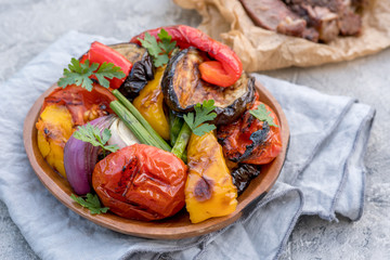 Grilled vegetables salad with eggplant, onions, peppers, asparagus and tomato