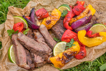 Beef Fajitas with colorful bell peppers on a table