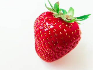 Red strawberry on white background. Summer tasty berry. Macro food photo