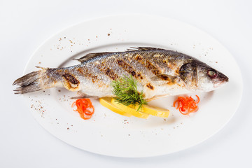 Sea food. Sea bass baked on the grill (top view close)