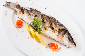Sea food. Sea bass baked on the grill (top view close)