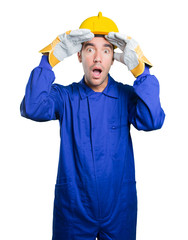 Astonished workman with search gesture on white background