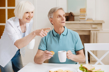 Observant inspired woman pointing at something