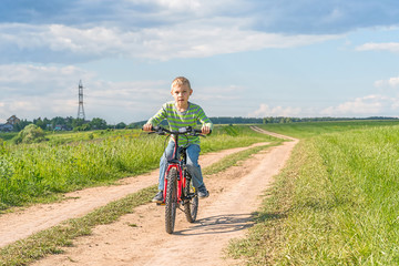 Naklejka premium child on a bicycle