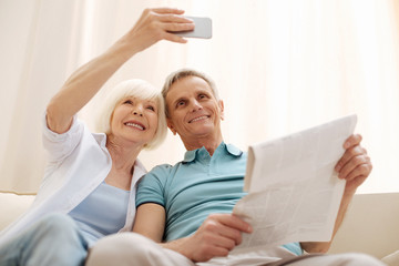 Fototapeta premium Sweet romantic elderly couple taking a selfie