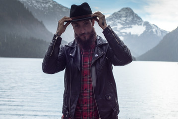 Photoshooting stylish bearded guys Hipster by Mountain Lake in Austria