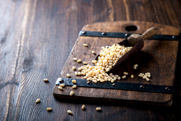 Pine Nut , in Vintage shovel on Wooden Background.Vegetarian.Concept of Healthy Food.Copy space....