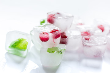fresh cranberry in ice cubes on white background mock-up