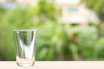 Water glass on wooden table.
