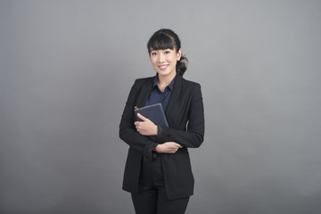 Obraz na płótnie Canvas Beautiful Business Woman confident on grey background