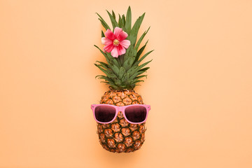 Fashion Hipster Pineapple Fruit. Bright Summer Color, Accessories. Tropical pineapple with Sunglasses. Creative Art concept. Minimal style. Summer party background