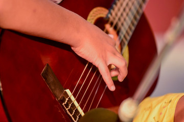 boy plays guitar