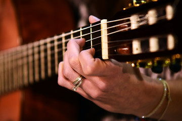 close up woman guitar player