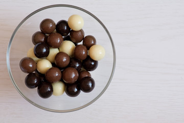 Round chocolate candies with peanuts