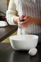 Woman shef female hands holding flour, prepearing, mixing dough from white flour