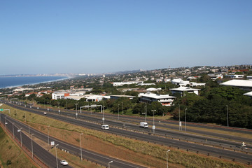Highway Heading Toward and Leaving Coastal Urban Landscape