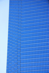 close up on modern office building skyscraper blue glass wall