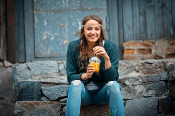 Laughing young woman holding orange juice, healthy lifestyle, fu