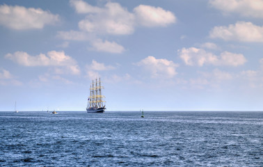 Fototapeta na wymiar Sailing ship in the blue sea