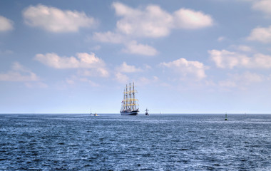 Sailing ship in the blue sea