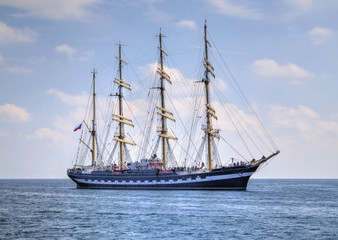 Sailing ship in the blue sea
