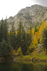 Fall Trees, Lake and Rocky Cliffs