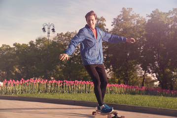 A man is riding a skateboard in the park