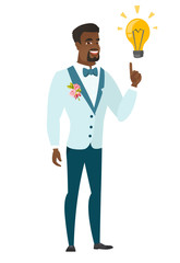 Groom pointing at business idea light bulb.