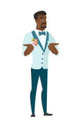 African confused groom shrugging shoulders.
