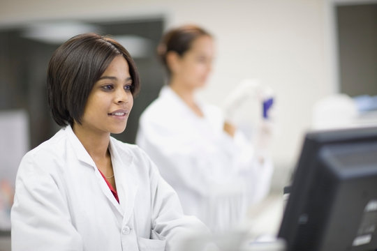 Scientist using computer in lab