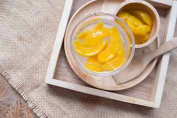 Fresh sparkling beverage with slice peaches