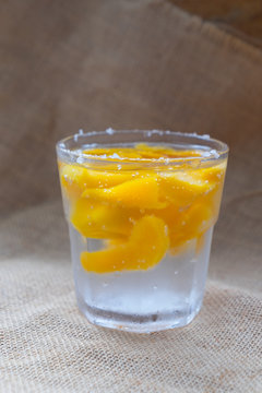 Soda with peaches in glass