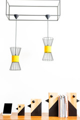 Modern computer and decorative statuettes with documents on table