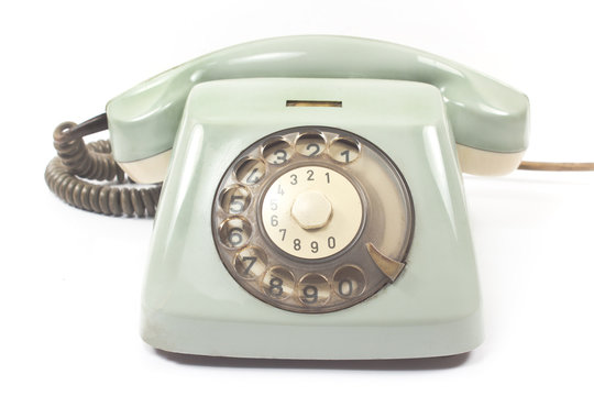 Old telephone isolated on white background