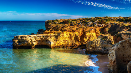 Portugal: beautiful rocks in the coast of Algarve at sunset
