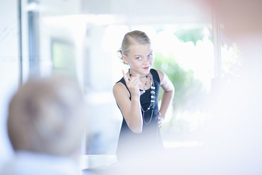 Girl playing businesswoman at desk