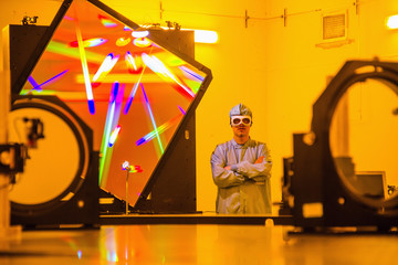 Scientist in optical research lab