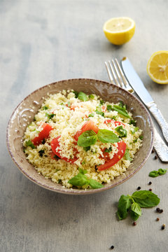 Couscous with parsley, tomato, lemon and olive oil. Traditional Arabic Salad Tabbuleh
