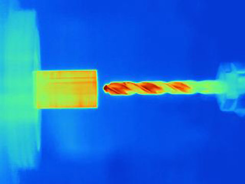 Thermal image of drilling into a component, showing the heat bulidup on the drill bit and the part