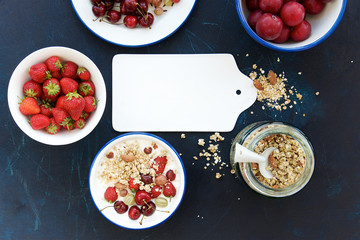 Homemade granola with fresh berries and fruits. Food background, top view 
