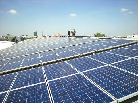 Solar PV Rooftop with Workers Walking