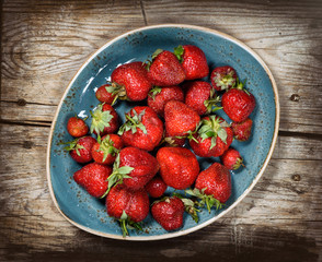 Red berries strawberry on wooden background