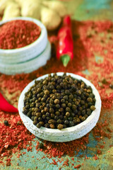 Red hot chili Cayenne and black pepper fresh and dried powdered spice, ready to use.