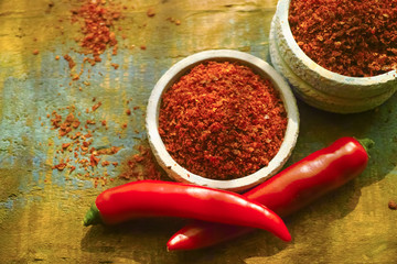 Red hot chili Cayenne pepper fresh and dried powdered spice, ready to use.