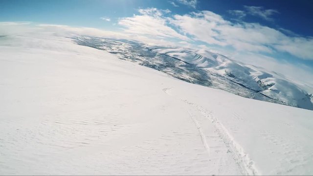 Man skier skiing down mountain - sunny day - first person view