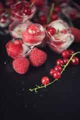Frozen berries on wooden table