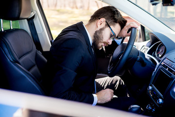 Obraz premium Tired man in a car