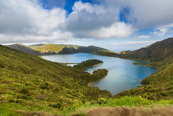 Fototapeta na wymiar Lake of Fire (Lagoa do Fogo) in the crater of the volcano Pico do Fogo on the island of Sao Miguel