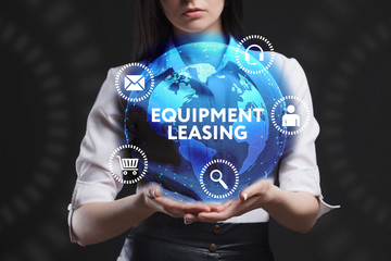 The concept of business, technology, the Internet and the network. A young entrepreneur working on a virtual screen of the future and sees the inscription: Equipment leasing